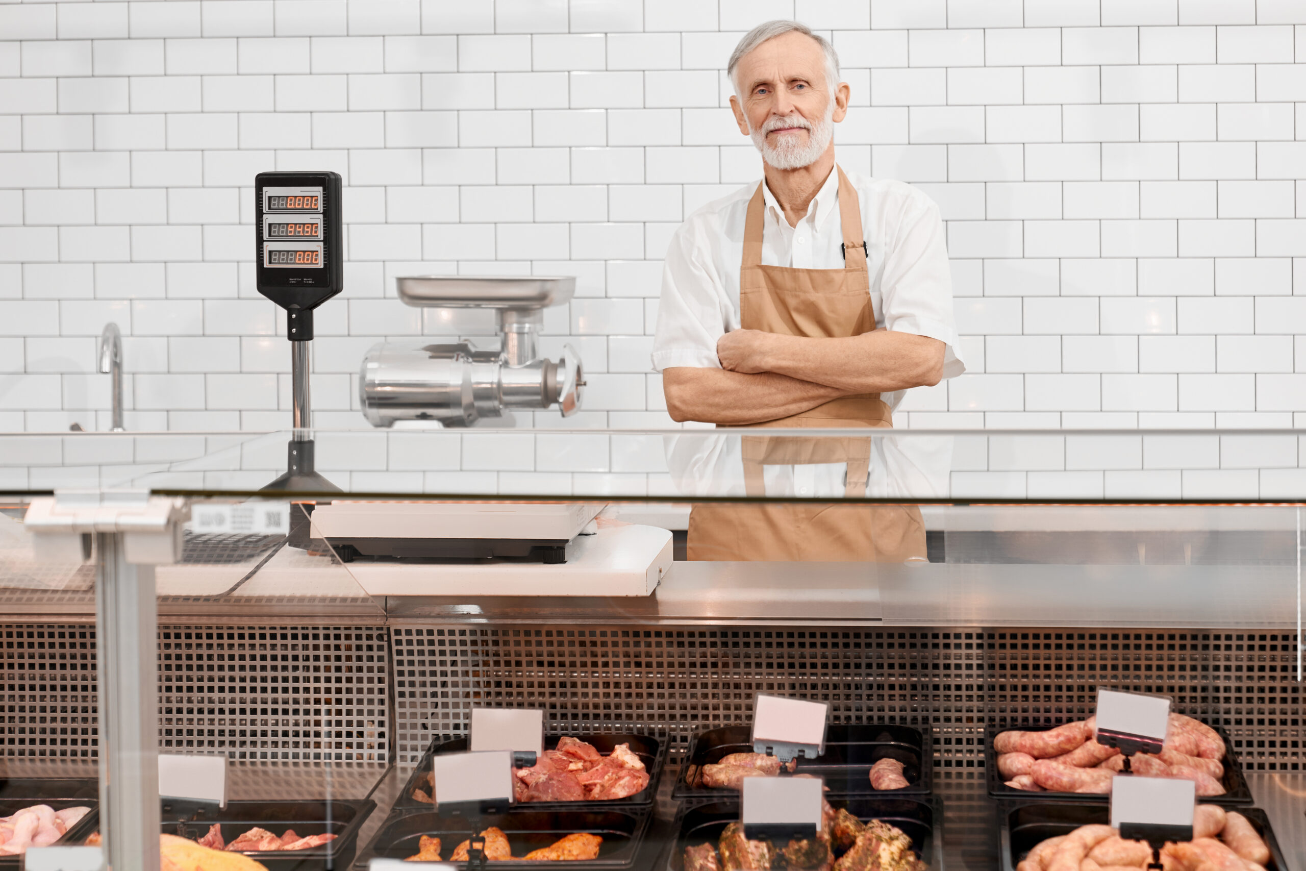 Butcher behind the counter at a butcher shop